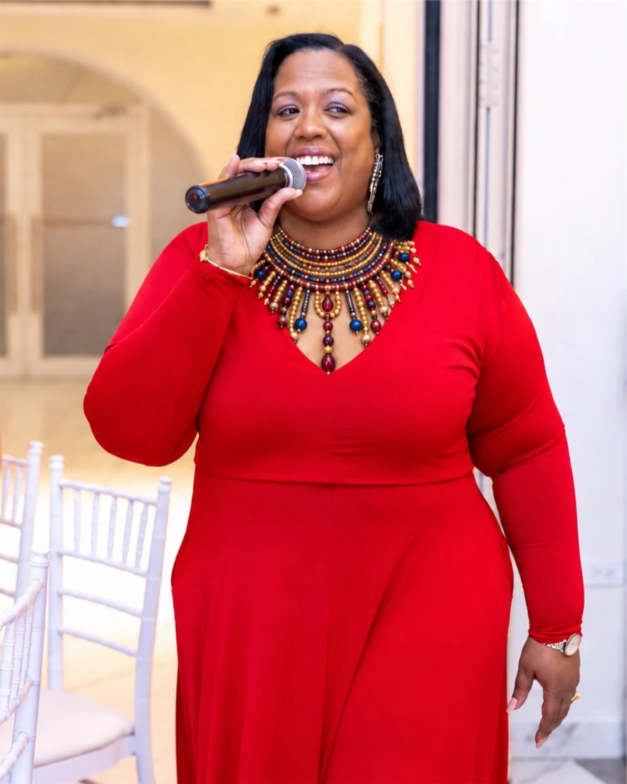 Queen B singing among dinner guests
